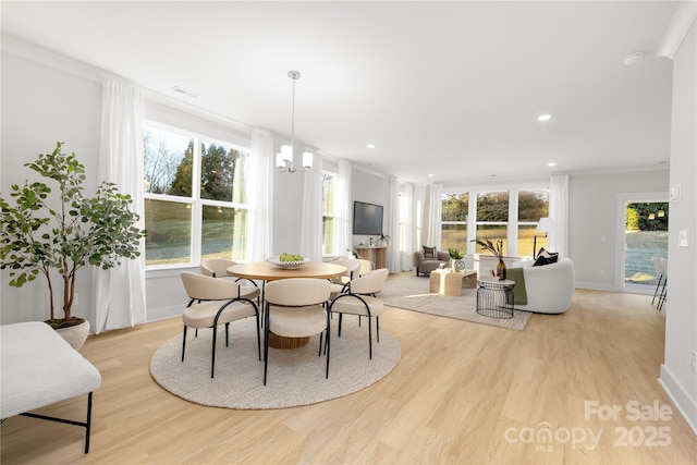 dining space with visible vents, recessed lighting, light wood finished floors, and crown molding