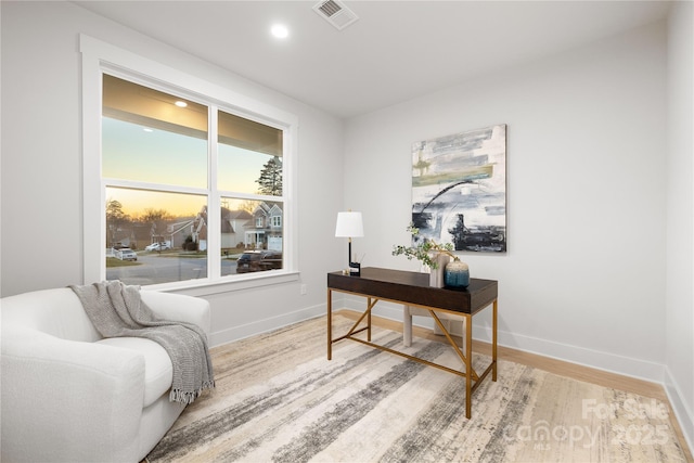 office with baseboards, recessed lighting, wood finished floors, and visible vents