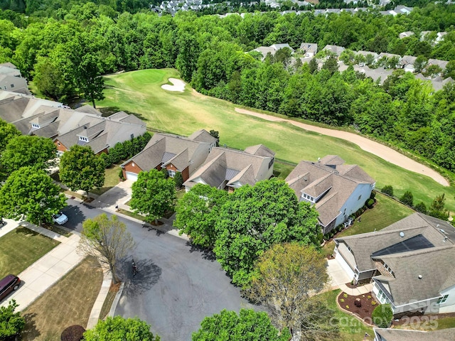 drone / aerial view with a residential view and view of golf course