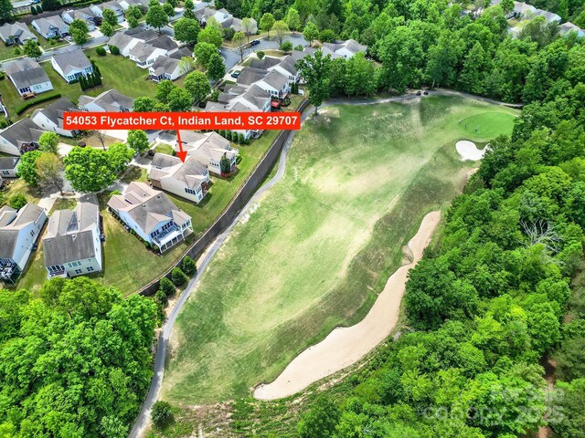 aerial view featuring golf course view and a residential view
