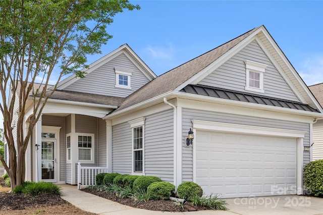 16291 Raven Crest Dr, Indian Land, SC 29707 - view of front of home with a shingled roof, a garage, a standing seam roof, driveway, and metal roof
