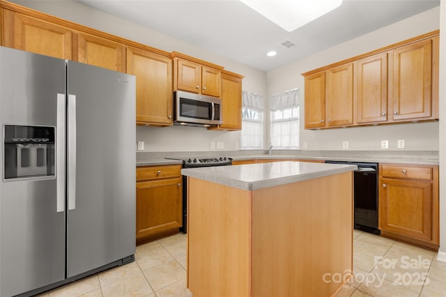 16291 Raven Crest Dr, Indian Land, SC 29707 - kitchen with light tile patterned floors, appliances with stainless steel finishes, a center island, and visible vents