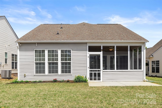 16291 Raven Crest Dr, Indian Land, SC 29707 - rear view of house with a sunroom, a lawn, central air condition unit, and roof with shingles
