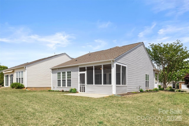 16291 Raven Crest Dr, Indian Land, SC 29707 - back of house with a sunroom, roof with shingles, and a yard