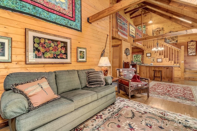 41 Log Cabin Dr, Maggie Valley, NC 28751 - living room with wood-type flooring, high vaulted ceiling, wood walls, and beamed ceiling