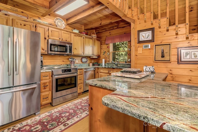 41 Log Cabin Dr, Maggie Valley, NC 28751 - kitchen featuring wooden walls, beamed ceiling, appliances with stainless steel finishes, and wooden ceiling