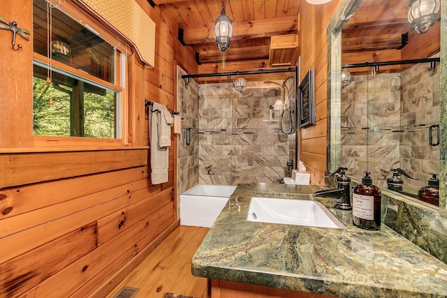 41 Log Cabin Dr, Maggie Valley, NC 28751 - full bathroom with wooden walls, vanity, wooden ceiling, wood finished floors, and tiled shower