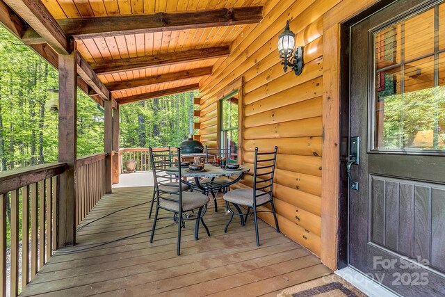 41 Log Cabin Dr, Maggie Valley, NC 28751 - wooden deck with grilling area and outdoor dining space