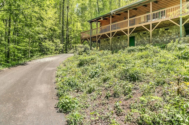41 Log Cabin Dr, Maggie Valley, NC 28751 - exterior space with a deck, stone siding, and a forest view