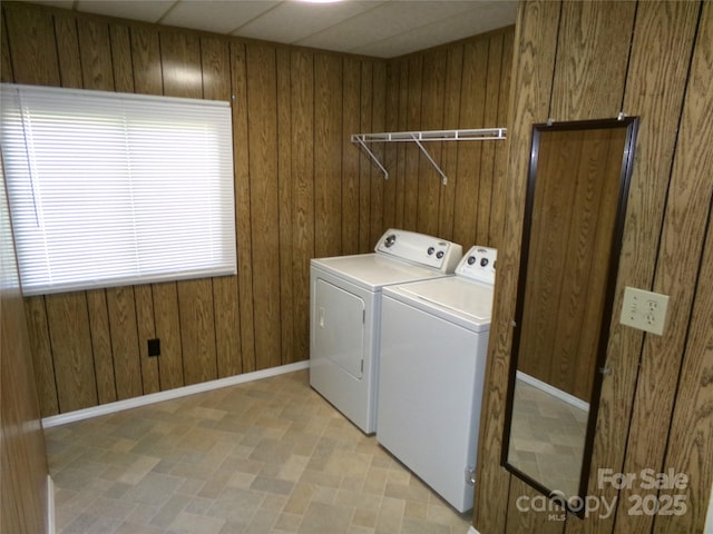 44716 Gold Branch Rd, Richfield, NC 28137 - clothes washing area featuring independent washer and dryer, laundry area, wood walls, baseboards, and light floors