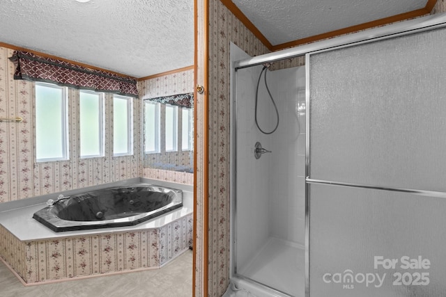 full bathroom with a textured ceiling, wallpapered walls, a shower stall, and a bath