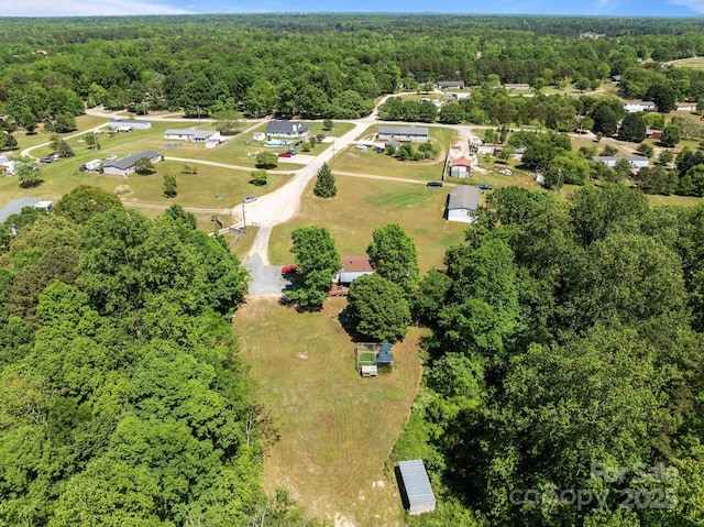 drone / aerial view with a forest view
