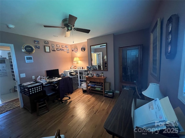 home office with a ceiling fan and wood finished floors