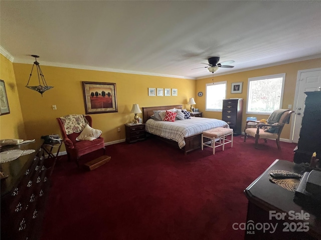 carpeted bedroom with baseboards, ornamental molding, and ceiling fan