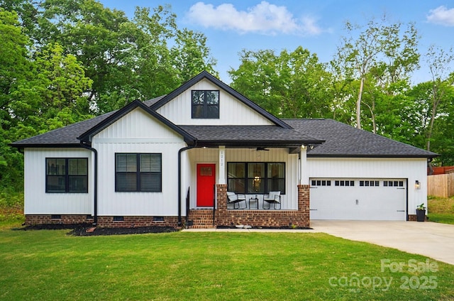 modern inspired farmhouse with a garage, a front lawn, covered porch, crawl space, and driveway