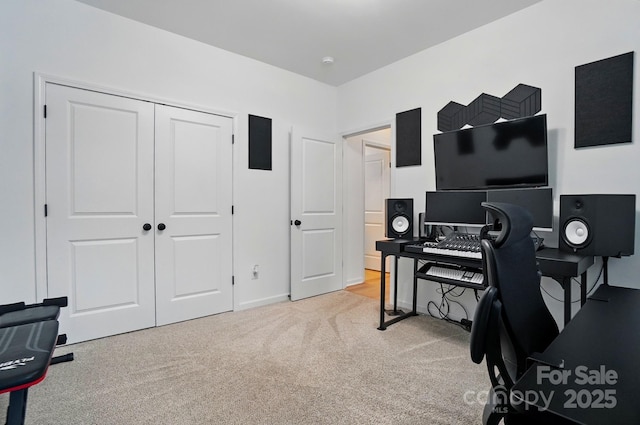 home office with baseboards and carpet flooring