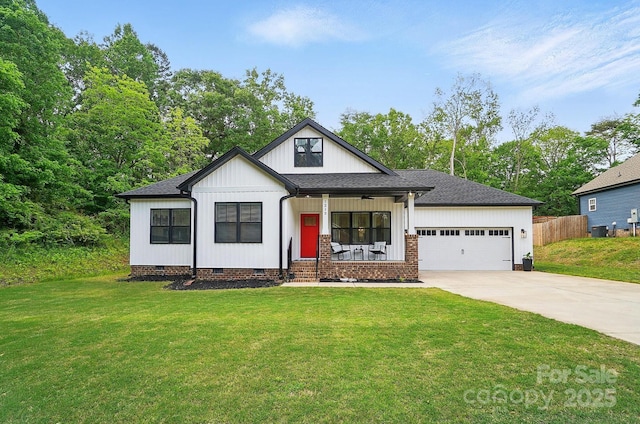 view of front of property with a garage, a front yard, crawl space, concrete driveway, and covered porch