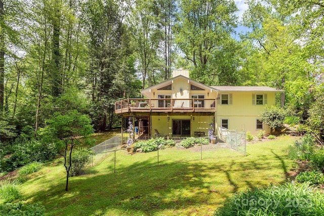 back of house with a deck