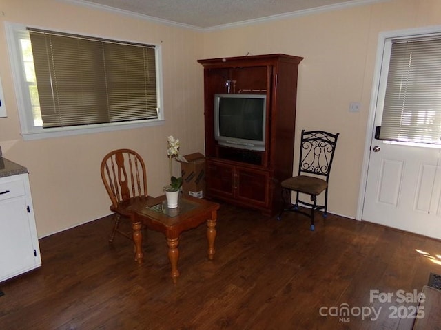 dining space featuring ornamental molding and dark wood-style flooring