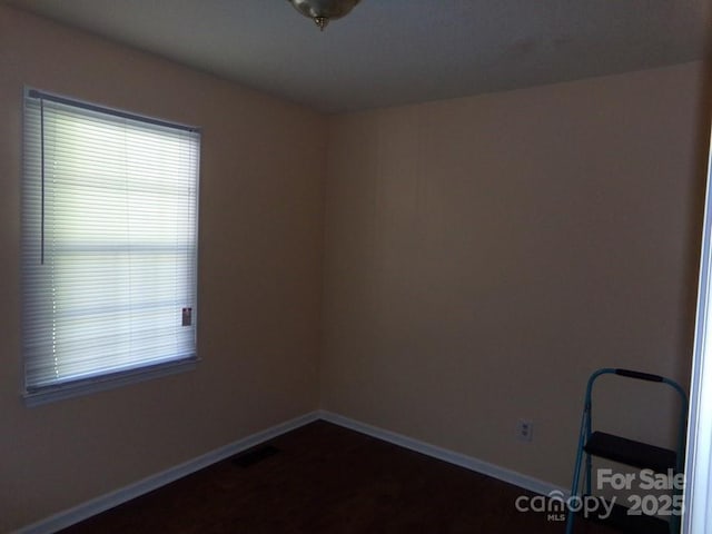 556 Roundtree Cir, Chester, SC 29706 - unfurnished room with baseboards and dark wood-style floors