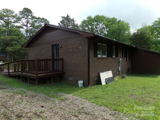 556 Roundtree Cir, Chester, SC 29706 - view of home's exterior with a wooden deck, brick siding, a yard, and crawl space