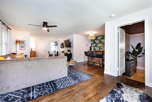 1816 Anderson St, Charlotte, NC 28205 - living room with baseboards, a ceiling fan, and dark wood-type flooring