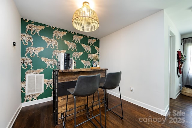 1816 Anderson St, Charlotte, NC 28205 - bar featuring baseboards, visible vents, a dry bar, and wood finished floors
