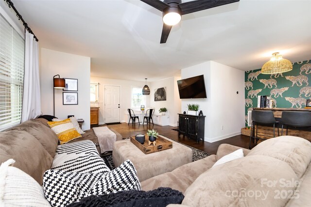 1816 Anderson St, Charlotte, NC 28205 - living room featuring a ceiling fan, baseboards, and wood finished floors
