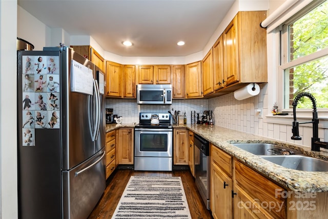 1816 Anderson St, Charlotte, NC 28205 - kitchen with a sink, dark wood-style flooring, appliances with stainless steel finishes, and light stone countertops