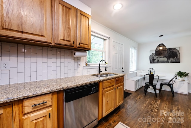 1816 Anderson St, Charlotte, NC 28205 - kitchen with light stone counters, a sink, dark wood finished floors, backsplash, and stainless steel dishwasher