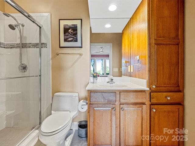 full bath featuring toilet, recessed lighting, a shower stall, and vanity