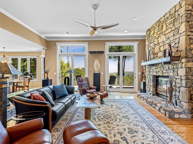 543 Hagen Dr, Hendersonville, NC 28739 - living area with ornamental molding, ceiling fan, wood finished floors, and a fireplace
