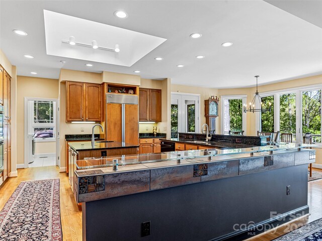 543 Hagen Dr, Hendersonville, NC 28739 - kitchen featuring recessed lighting, paneled refrigerator, light wood-style floors, and a spacious island