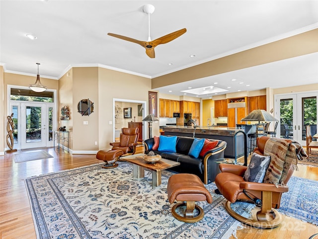 543 Hagen Dr, Hendersonville, NC 28739 - living room featuring baseboards, ornamental molding, french doors, and light wood finished floors