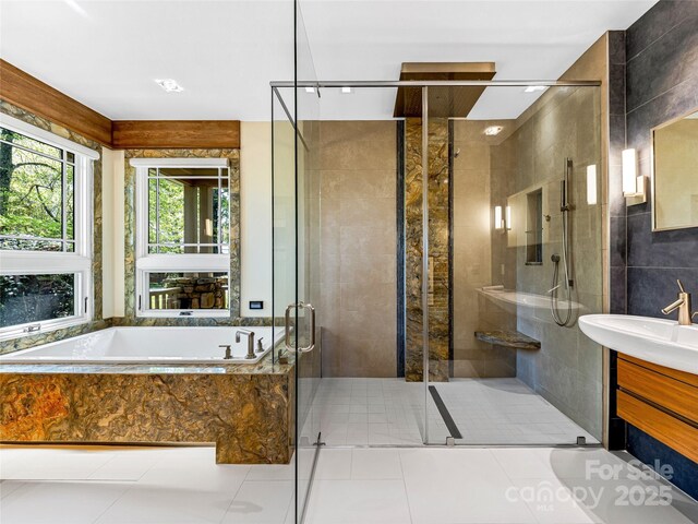543 Hagen Dr, Hendersonville, NC 28739 - full bathroom with tile patterned flooring, vanity, tile walls, a shower stall, and a bath