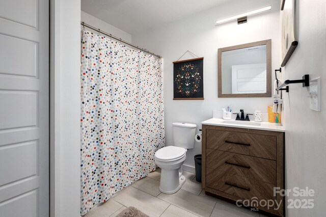 full bath with vanity, tile patterned floors, toilet, and curtained shower