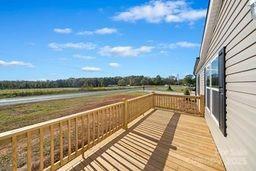 wooden terrace with a rural view