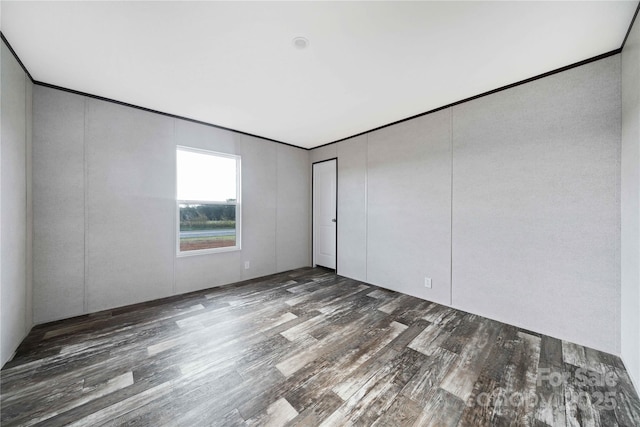 unfurnished room featuring wood finished floors