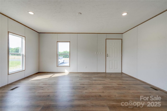 445 Davis Rd, Shelby, NC 28152 - unfurnished room with crown molding, visible vents, wood finished floors, and recessed lighting