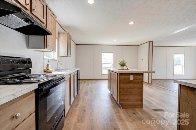 445 Davis Rd, Shelby, NC 28152 - kitchen featuring a center island, a sink, black / electric stove, light wood-type flooring, and under cabinet range hood