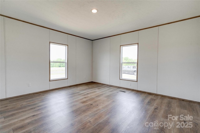 445 Davis Rd, Shelby, NC 28152 - empty room featuring crown molding, a wealth of natural light, and wood finished floors