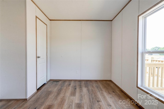 445 Davis Rd, Shelby, NC 28152 - empty room with ornamental molding and light wood finished floors