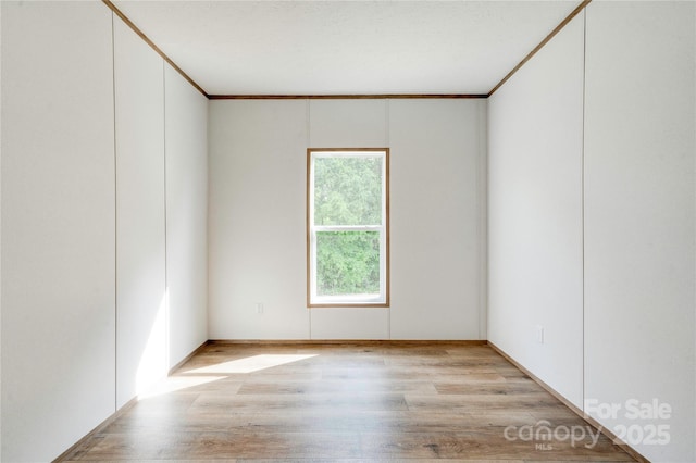445 Davis Rd, Shelby, NC 28152 - unfurnished room featuring crown molding and light wood-style flooring