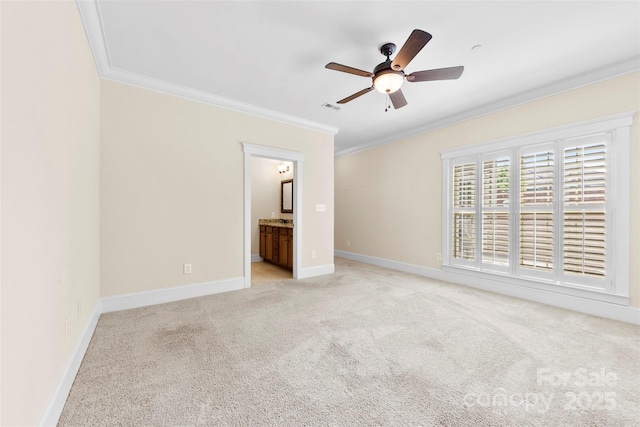 unfurnished bedroom featuring crown molding, visible vents, light carpet, baseboards, and connected bathroom