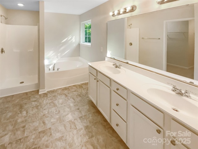 full bath with a sink, a bath, and a shower