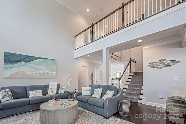 living room with crown molding, stairs, wood finished floors, baseboards, and recessed lighting
