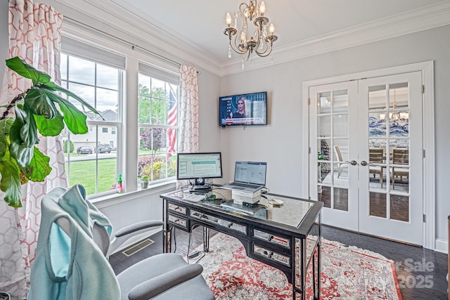 office space featuring crown molding, a healthy amount of sunlight, french doors, and a notable chandelier