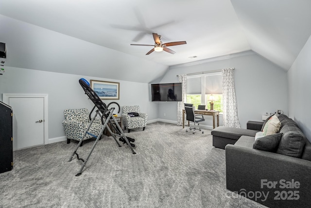 interior space featuring baseboards, a ceiling fan, vaulted ceiling, and carpet flooring