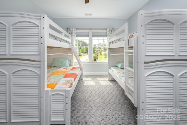 bedroom with visible vents, a ceiling fan, carpet, and baseboards