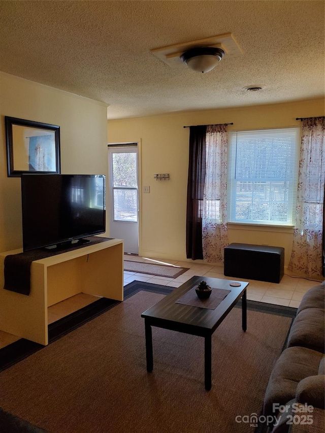 living area with a textured ceiling